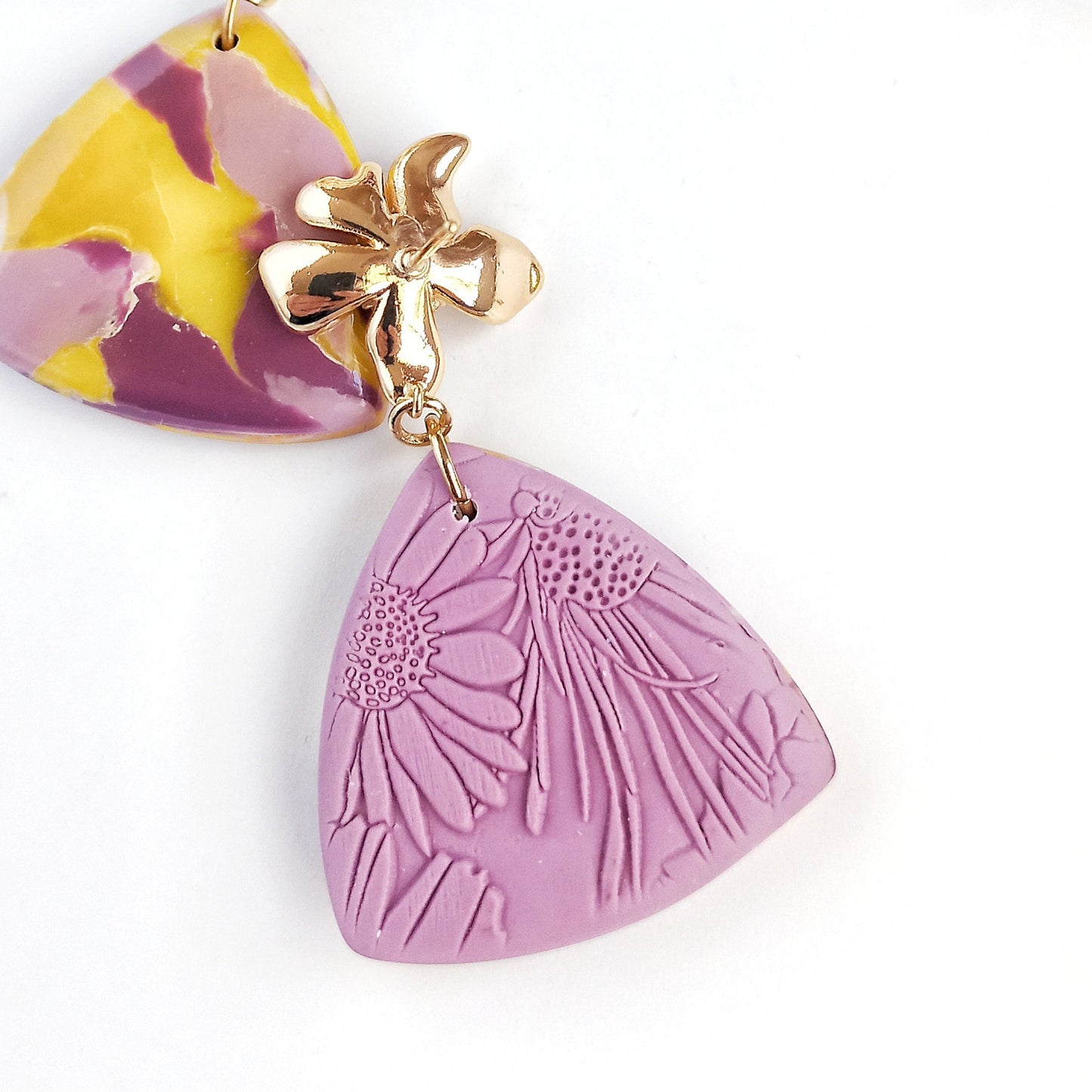 Whispered Marble - Medium triangle earring with cubic zirconia flower
